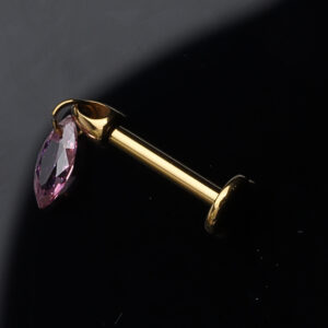 Gold titanium threadless labret with magenta teardrop gem, 16g thickness, 8mm length.