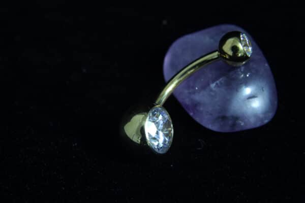 Silver titanium belly ring with clear jewel, 14-gauge thickness, and 4mm and 8mm ball ends