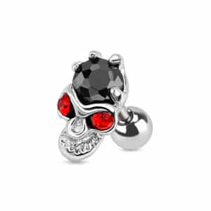 silver skull barbell with red eyes and black gem in hand