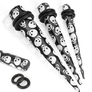 Black solid acrylic taper with printed skulls and black O-rings in 8GA and 6GA