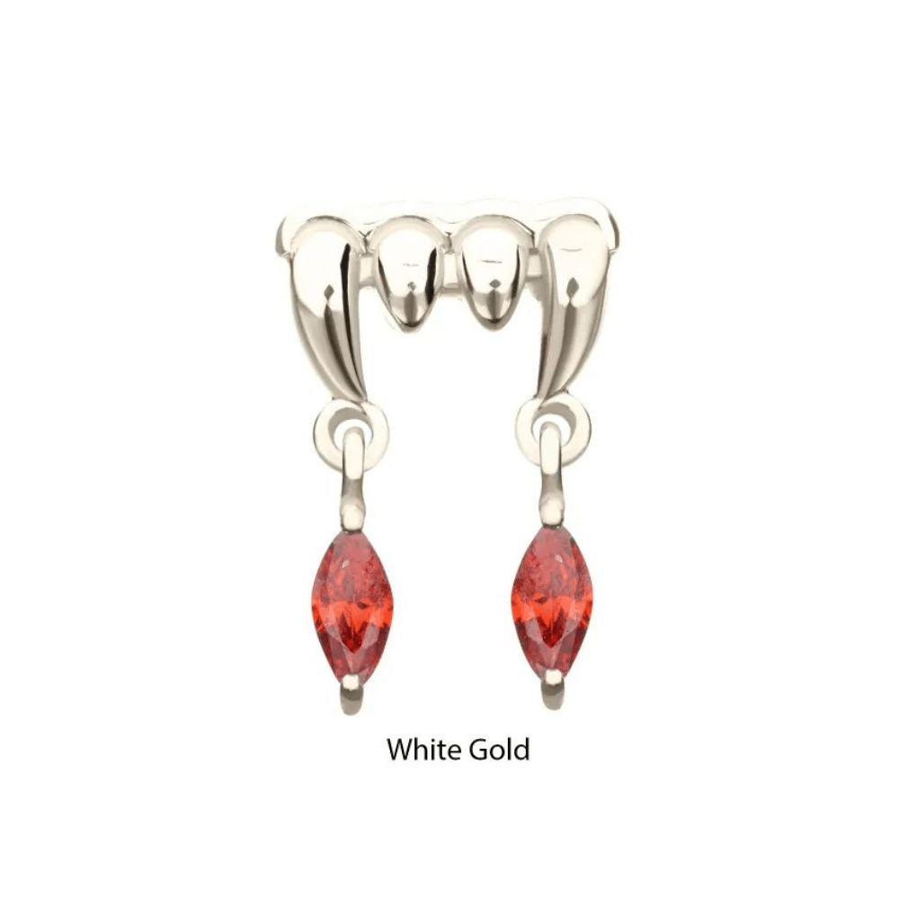 Product Name 14Kt Gold Threadless Dripping Fangs with Garnet Dangle – Spooky Obsession Collection Short Description Gothic-inspired 14kt gold dripping fangs top with a garnet marquise gem dangle, designed for Invictus threadless body jewelry. Long Description Part of the Invictus Body Jewelry Spooky Obsession Collection, this 14Kt Gold Threadless Dripping Fangs Top with Garnet Marquise Gem Dangle blends gothic elegance with expert craftsmanship. Made from solid 14kt nickel-free gold with a durable 316LVM ASTM F-138 implant-grade steel pin, it’s built for comfort, safety, and style. The deep red garnet marquise gem dangle adds a touch of luxury and mystique, perfect for mixing and matching with other Invictus spooky-themed tops. Measuring 8.5mm (L) x 6.8mm (W) x 1.4mm (THK) with a 5.2mm dangle and 3mm gem, this versatile piece brings a stylish homage to creatures of the night, elevating any Ear-semble with gothic glamour.