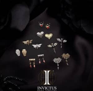 Invictus 14kt gold threadless dripping fangs top with blood-red garnet marquise gem dangle from the Spooky Obsession Collection.